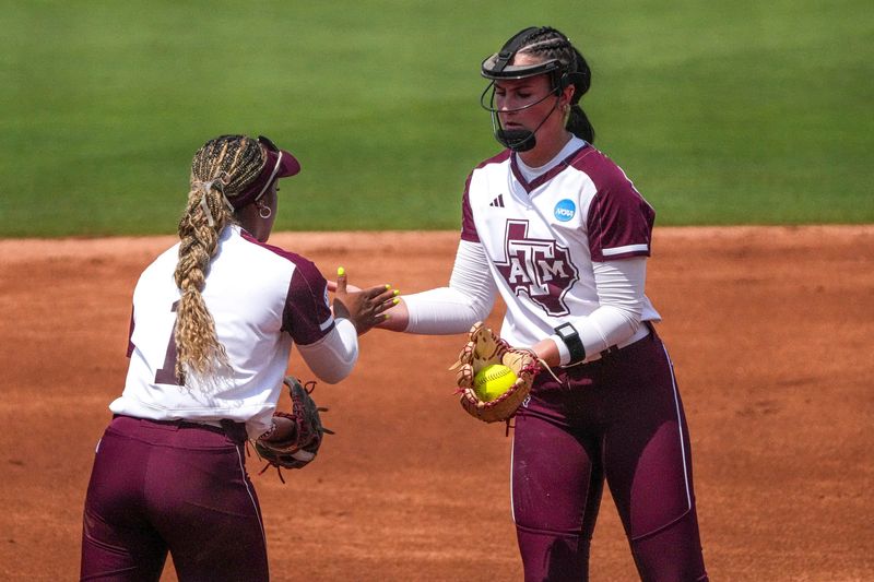 Texas A&M infielder Kennedy Powell (1) celebrates a strikeout by pitcher Sydney Lessentine (7) during the NCAA D1 Softball Tournament Regional against Saint Francis University at Davis Diamond at Texas A&M University on Friday, May 16, 2025 in College Station, Texas.