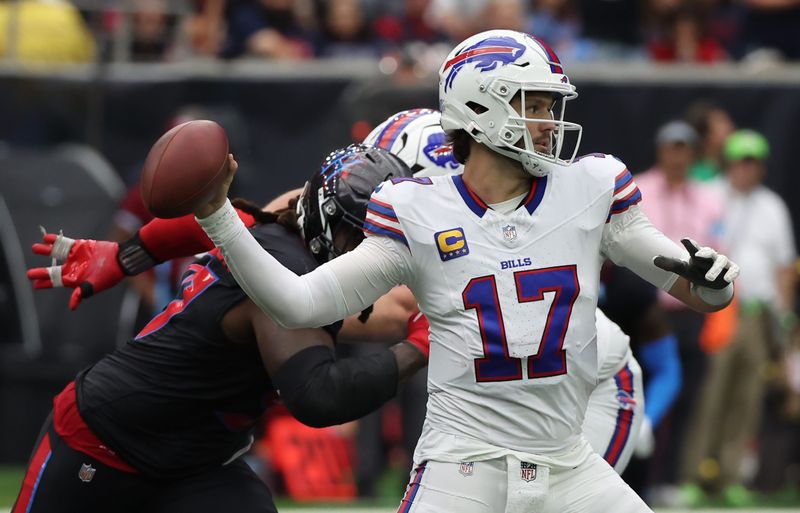 Oct 6, 2024; Houston, Texas, USA; Buffalo Bills quarterback Josh Allen (17) drops back to pass against the Houston Texans in the second half at NRG Stadium. Mandatory Credit: Thomas Shea-Imagn Images