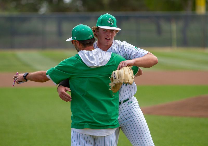 Wall baseball coach Jeremy Gordon and Reid Ballard (4) embrace after an inning against Idalou at Midland College's Christensen Stadium on Saturday, May 17, 2025.
