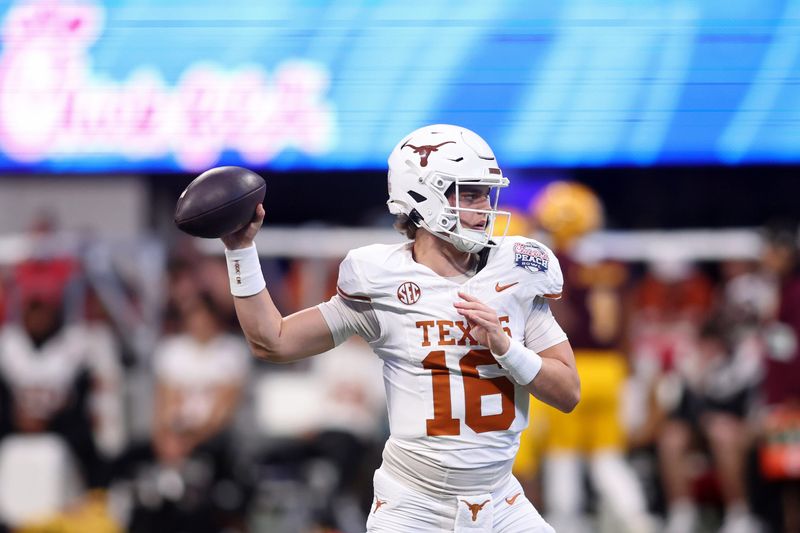 Jan 1, 2025; Atlanta, GA, USA; Texas Longhorns quarterback Arch Manning (16) warms up before the Peach Bowl at Mercedes-Benz Stadium.