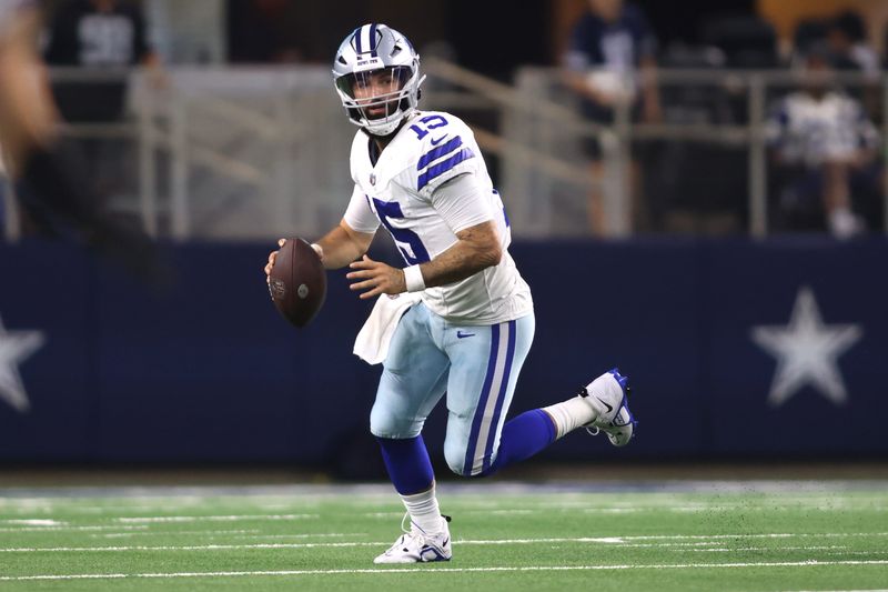 Aug 26, 2023; Arlington, Texas, USA; Dallas Cowboys quarterback Will Grier (15) rolls out in the second quarter against the Las Vegas Raiders at AT&T Stadium. Mandatory Credit: Tim Heitman-USA TODAY Sports
