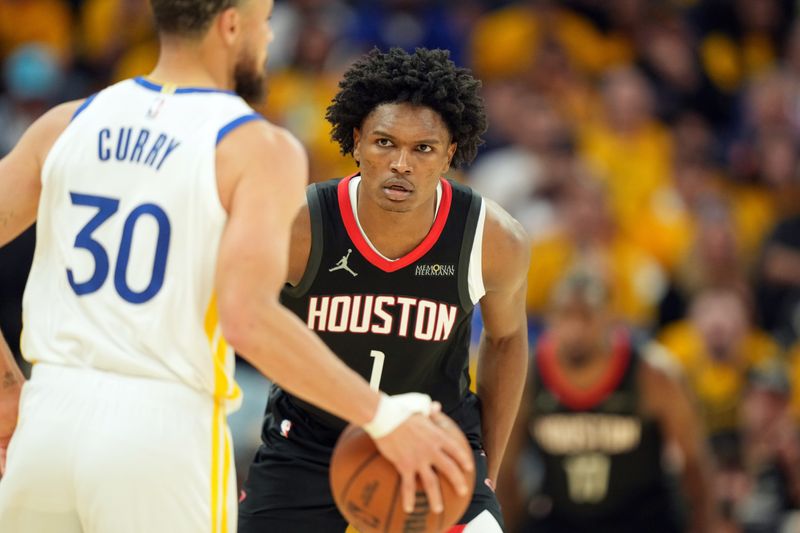 Apr 26, 2025; San Francisco, California, USA; Houston Rockets forward Amen Thompson (1) defends against Golden State Warriors guard Stephen Curry (30) during the third quarter of game three of first round for the 2024 NBA Playoffs at Chase Center. Mandatory Credit: Darren Yamashita-Imagn Images