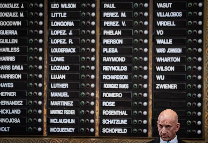 State Rep. Matt Shaheen, R-Plano, in front of the vote-tally board in the Texas House chamber.