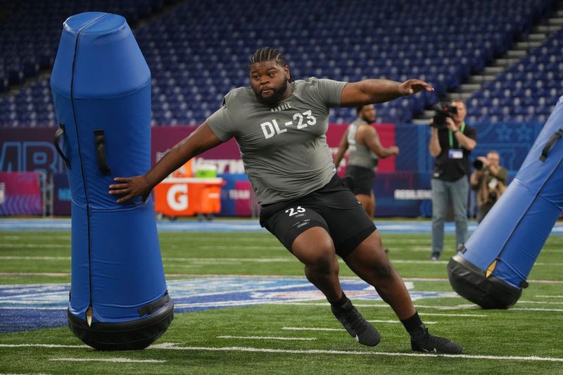 Feb 29, 2024; Indianapolis, IN, USA; Auburn defensive lineman Justin Rogers (DL23) works out during the 2024 NFL Combine at Lucas Oil Stadium. Mandatory Credit: Kirby Lee-USA TODAY Sports