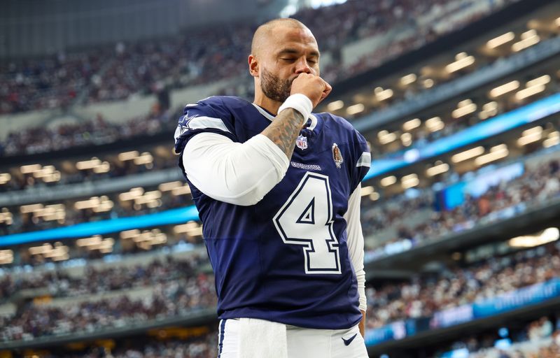 Oct 13, 2024; Arlington, Texas, USA; Dallas Cowboys quarterback Dak Prescott (4) prays before the game against the Detroit Lions at AT&T Stadium. Mandatory Credit: Kevin Jairaj-Imagn Images