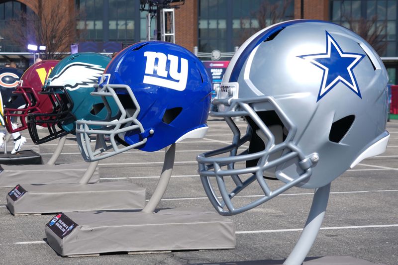 Feb 27, 2025; Indianapolis, IN, USA; NFC East helmets of the Dallas Cowboys, New York Giants, Philadelphia Eagles and Washington Commanders at the 2025 NFL Scouting Combine Experience at Lucas Oil Stadium. Mandatory Credit: Kirby Lee-Imagn Images