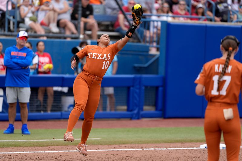 Texas third baseman Mia Scott makes a leaping catch in the sixth inning of the Longhorns' 3-0 win over Florida in a Women's College World Series game Thursday at Devon Park in Oklahoma City. Scott is nearing the end of a brilliant collegiate career and does not plan to pursue a professional career, Texas coach Mike White said.