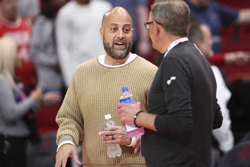 Apr 2, 2025; Houston, Texas, USA; Houston Rockets general manager Rafael Stone talks on the court before the game against the Utah Jazz at Toyota Center. Mandatory Credit: Troy Taormina-Imagn Images