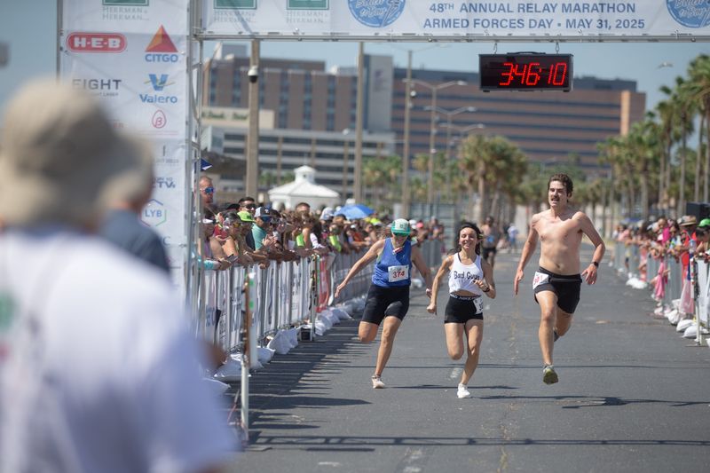 Runners race to the finish line at the 48th annual Beach to Bay Relay Marathon in Corpus Christi on May 31, 2025.