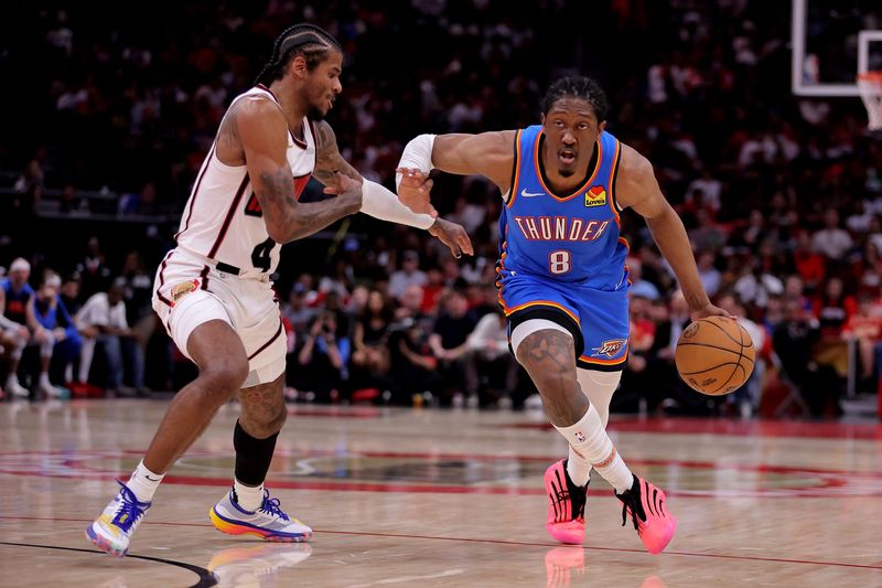 Apr 4, 2025; Houston, Texas, USA; Oklahoma City Thunder forward Jalen Williams (8) drives to the basket against Houston Rockets guard Jalen Green (4) during the third quarter at Toyota Center. Mandatory Credit: Erik Williams-Imagn Images