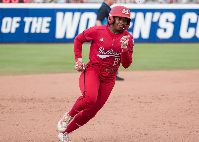 Jun 2, 2025; Oklahoma City, OK, USA; Texas Tech Red Raiders infielder Alana Johnson (21) rounds third and goes home to score in the second inning against the Oklahoma Sooners during the NCAA Softball Women's College World Series semifinal game at Devon Park. Mandatory Credit: Brett Rojo-Imagn Images