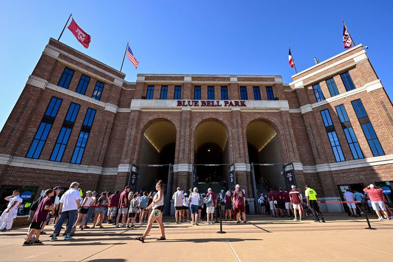 Jun 10, 2022; College Station, TX, USA; Fans entering Blue Bell Park prior to the game one of the Super Regional Series between the Texas A&M and the Louisville Mandatory Credit: Maria Lysaker-USA TODAY Sports