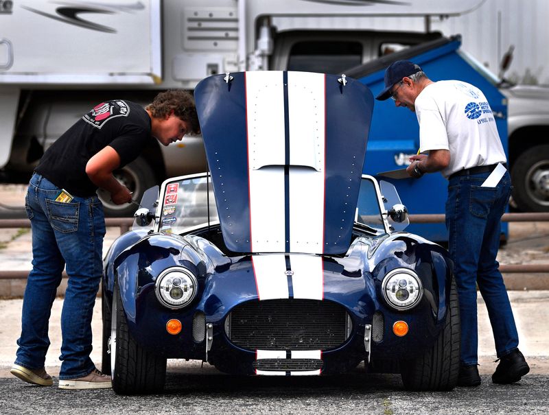 Jerrin's Hope is partnering with the United Methodist Service Center and Food Pantry to host their first-ever car show Saturday. 
Zane Fleming (left) and Robert Grabowski inspect a 1965 Ford Cobra during the car show at the 2025 Summer Bash in Cross Plains May 31, 2025.