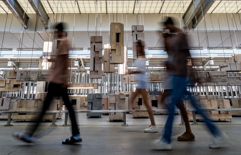 Travelers arrive at Austin-Bergstrom International Airport, May 7, 2025.