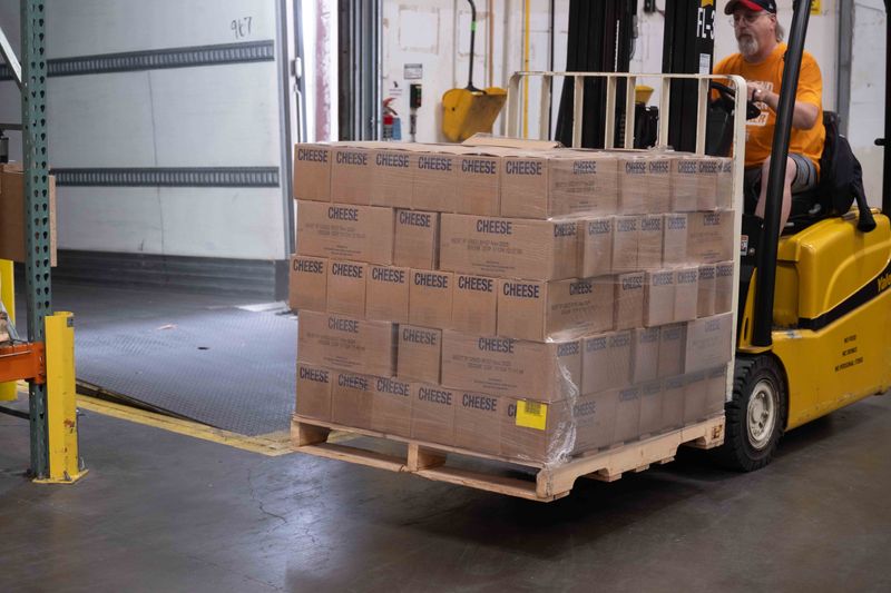 A forklift operator unloads pallets of donated cheese at the High Plains Food Bank warehouse in Amarillo on June 4. The donation was part of a truckload of dairy products from the Church of Jesus Christ of Latter-Day Saints.