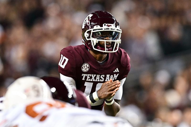 Nov 30, 2024; College Station, Texas, USA; Texas A&M Aggies quarterback Marcel Reed (10) calls a play during the first quarter against the Texas Longhorns. The Longhorns defeated the Aggies 17-7 at Kyle Field. Mandatory Credit: Maria Lysaker-Imagn Images