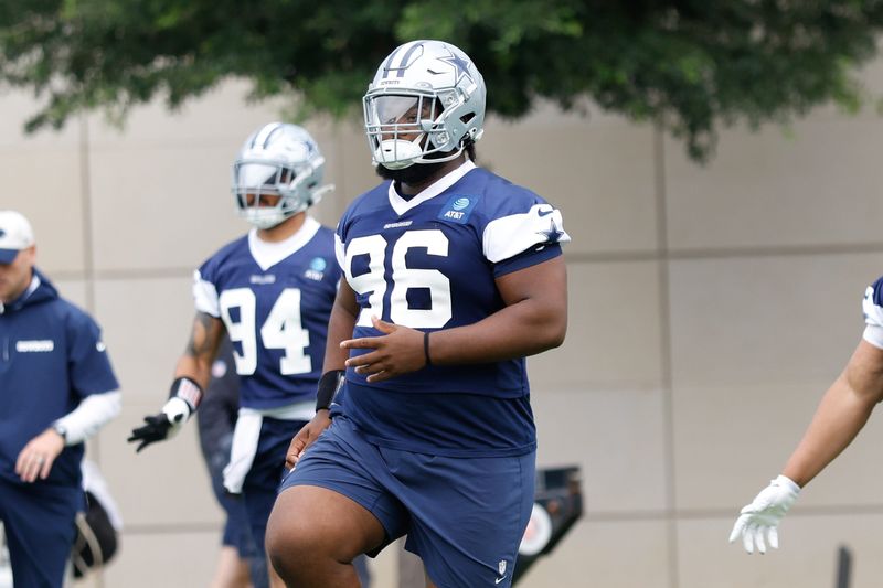 Jun 10, 2025; Arlington, TX, USA; Dallas Cowboys defensive tackle Justin Rogers (96) goes through a drill during practice at the Ford Center at the Star Training Facility in Frisco, Texas. Mandatory Credit: Chris Jones-Imagn Images