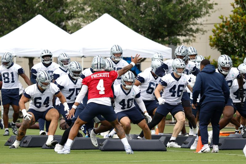 Jun 10, 2025; Arlington, TX, USA; Dallas Cowboys quarterback Dak Prescott (4) leads teammates through a drill at the Ford Center at the Star Training Facility in Frisco, Texas. Mandatory Credit: Chris Jones-Imagn Images