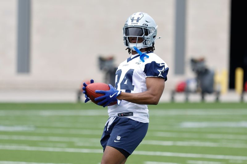 Jun 10, 2025; Arlington, TX, USA; Dallas Cowboys running back Jaydon Blue (34) goes through a drill during practice at the Ford Center at the Star Training Facility in Frisco, Texas. Mandatory Credit: Chris Jones-Imagn Images