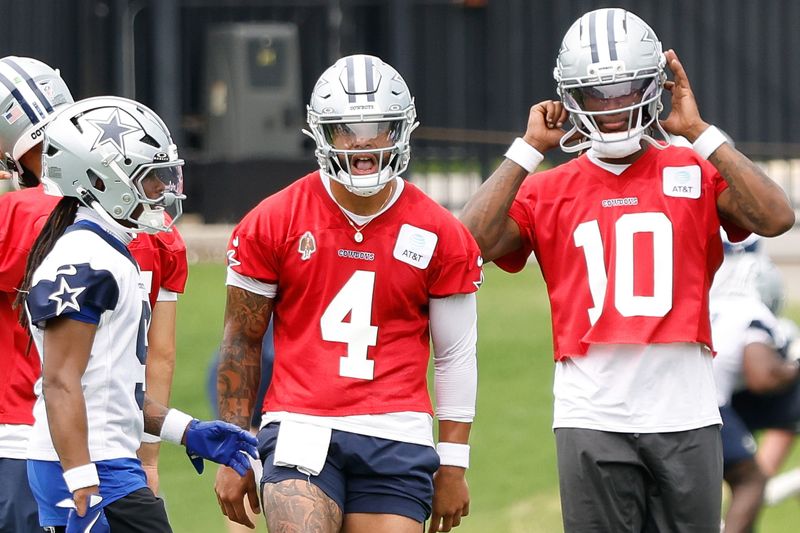 Jun 10, 2025; Arlington, TX, USA; Dallas Cowboys quarterback Dak Prescott (4) reacts during a practice drill at the Ford Center at the Star Training Facility in Frisco, Texas. Mandatory Credit: Chris Jones-Imagn Images