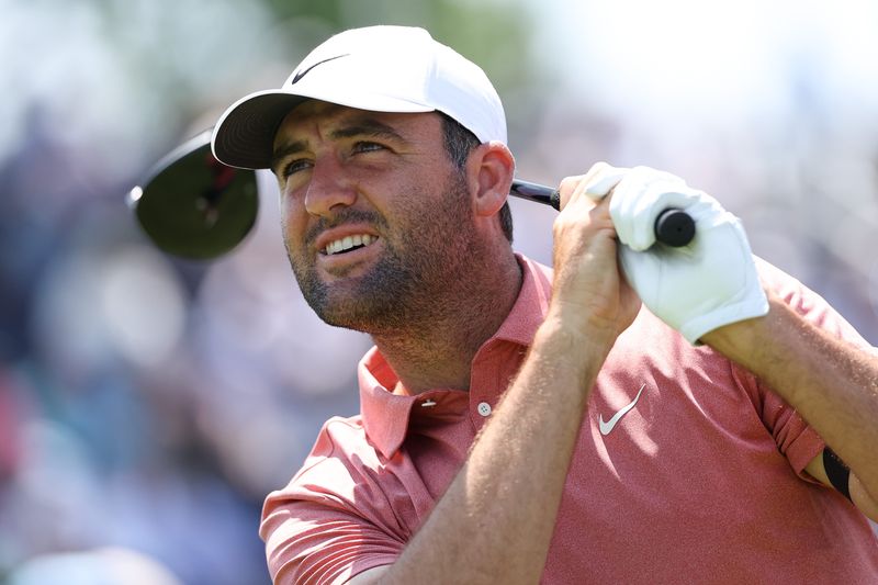 Jun 11, 2025; Oakmont, Pennsylvania, USA; Scottie Scheffler plays a shot from the 12th tee during a practice round for the U.S. Open golf tournament at Oakmont Country Club. Mandatory Credit: Bill Streicher-Imagn Images