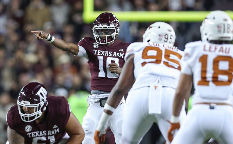Nov 30, 2024; College Station, Texas, USA; Texas A&M Aggies quarterback Marcel Reed (10) signals at the line of scrimmage during the first quarter against the Texas Longhorns at Kyle Field. Mandatory Credit: Troy Taormina-Imagn Images