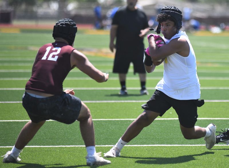 A Hale Center player runs after a catch against Roosevelt in the Sudan 7-on-7 football state-qualifying tournament Friday, June 13, 2025, at Hornet Field in Sudan.