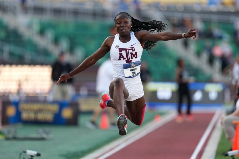 Jun 14, 2025; Eugene, OR, USA; Winny Bii of Texas A&M wins the women's triple jump at 45-9 3/4 (13.96m) during the NCAA Track and Field Championships at Hayward Field. Mandatory Credit: Kirby Lee-Imagn Images
