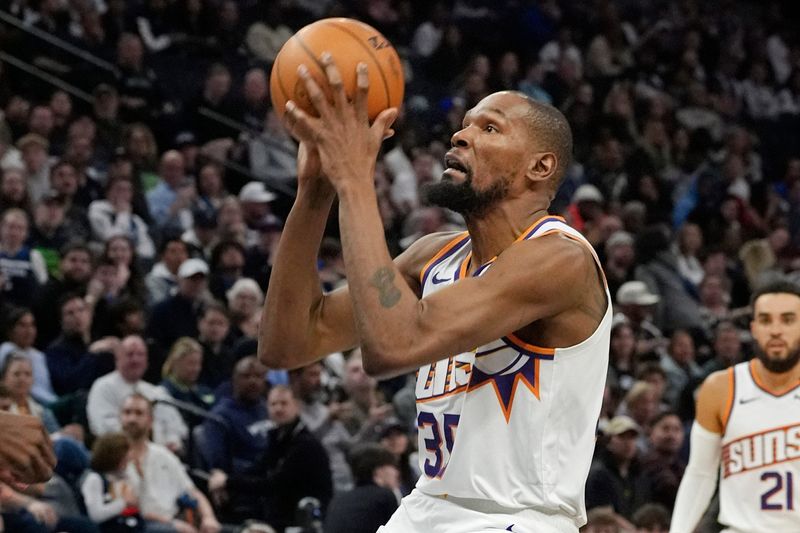 Mar 28, 2025; Minneapolis, Minnesota, USA; Phoenix Suns forward Kevin Durant (35) shoots against the Minnesota Timberwolves in the third quarter at Target Center. Mandatory Credit: Bruce Kluckhohn-Imagn Images