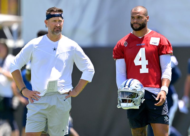 Jul 26, 2023; Oxnard, CA, USA; Dallas Cowboys quarterback Dak Prescott (4) talks with offensive coordinator Brian Schottenheimer during training camp at River Ridge Playing Fields in Oxnard, CA. Mandatory Credit: Jayne Kamin-Oncea-USA TODAY Sports