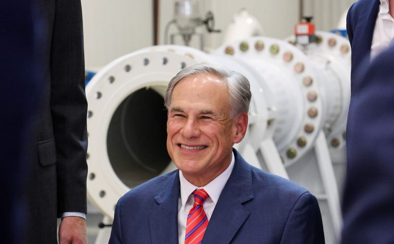 Gov. Greg Abbott smiles for photos after a signing ceremony for a $20 billion water investment bill at SIMFLO's Engineering Products Facility — 605 26th St. — on June 18, 2025 in Lubbock, Texas.