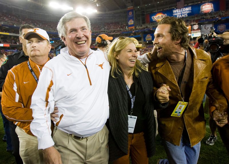 Texas Head Coach Mack Brown celebrates victory over Ohio State with his wife Sally and Matthew McConaughey in the Tostitos Fiesta Bowl at University of Phoenix Stadium in Glendale. Ariz. on Jan. 5, 2009.