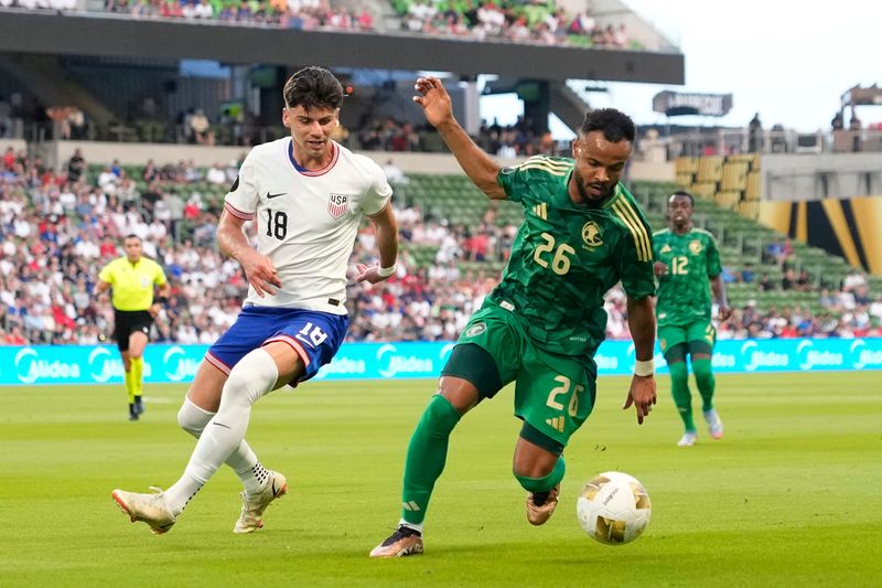 Saudi Arabia's Ali Majrashi, right, tries to fend off U.S. player Max Arfsten during a group stage match of the 2025 Gold Cup at Q2 Stadium in Austin Thursday.