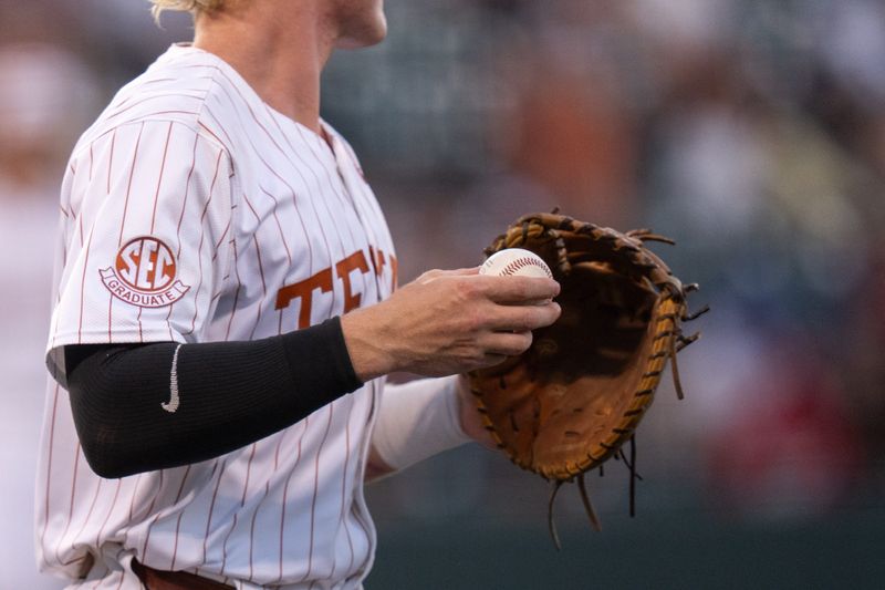 Texas catcher Kimble Schuessler (10) holds the ball during the Longhorns' game against Louisville at UFCU Disch-Falk Field in Austin Tuesday, May 6, 2025.