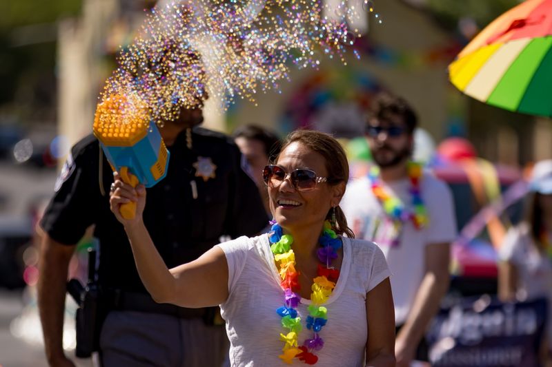 U.S. Rep. Veronica Escobar blows bubbles with a bubble machine during the 2025 Sun City Pride Parade in Downtown El Paso on Saturday, June 21.