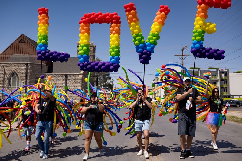 Rainbow balloons spelling out “LOVE” are carried during the 2025 Sun City Pride Parade in Downtown El Paso on Saturday, June 21.