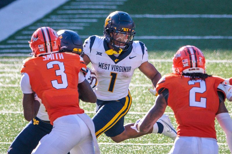 Oct 5, 2024; Stillwater, Oklahoma, USA; West Virginia Mountaineers running back Jahiem White (1) looks for an opening against the Oklahoma State Cowboys during the third quarter at Boone Pickens Stadium. Mandatory Credit: William Purnell-Imagn Images