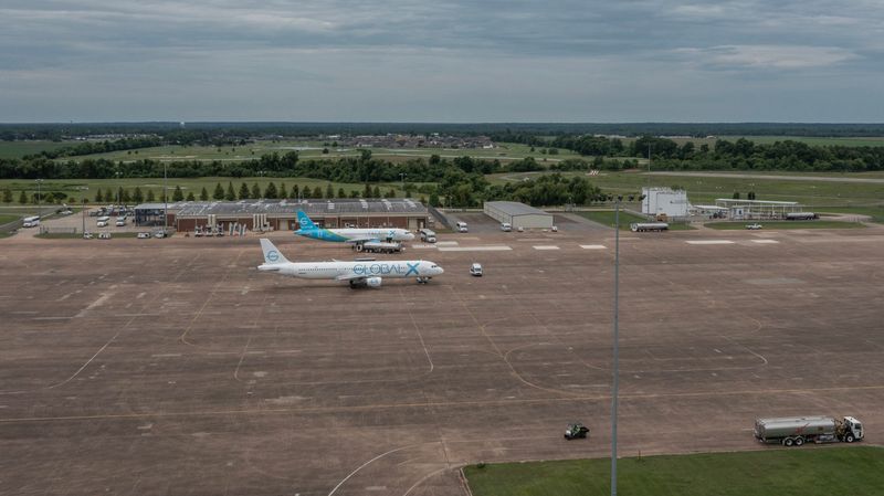 Two Global X airplanes are seen at the Alexandria Staging Facility in Alexandria, Louisiana, on June 9, 2025. The immigrant detention center sits on the tarmac.