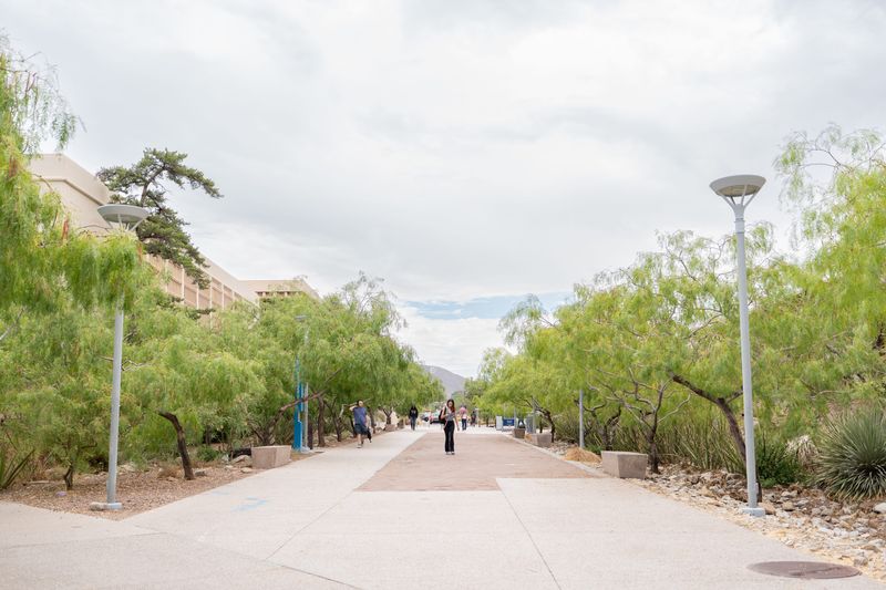 Students walk through Centennial Plaza at UTEP after a midday rain on June 25, 2025.