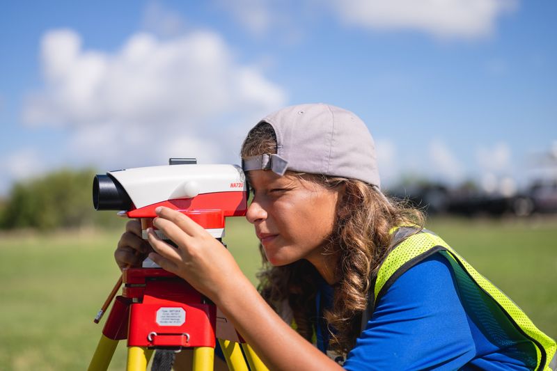 Camper Andrew Sperry uses land survey equipment at a geospatial engineering and land surveying summer camp at Texas A&M University-Corpus Christi on June 24, 2025.