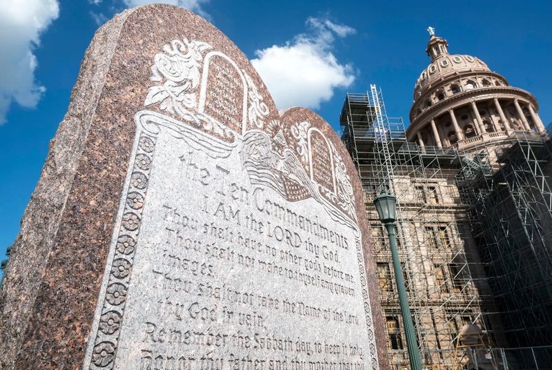 A group of faith leaders and parents from North Texas filed a lawsuit to stop a new Texas law that requires that public schools display the Ten Commandments, as seen on a monument at the state Capitol in Austin, on a poster in classrooms.