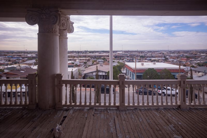 The El Paso skyline is visible from a second-floor balcony at the Albert B. Fall Mansion on June 27, 2025. The city is seeking to sell the 118-year-old vacant home at 1725 Arizona Ave. in Central El Paso.