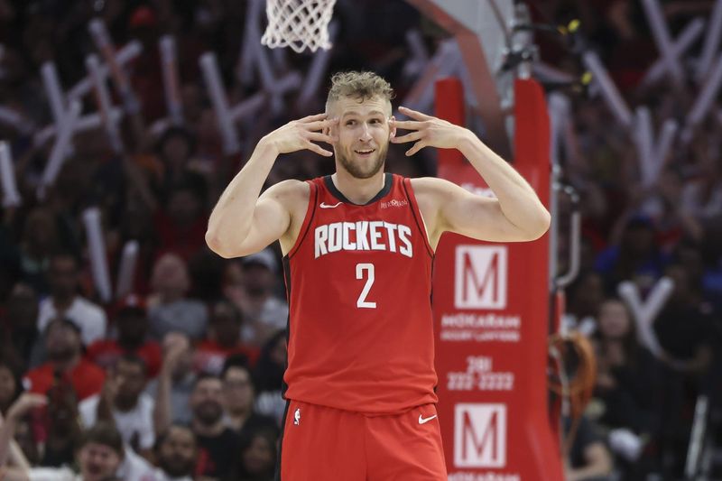 Apr 2, 2025; Houston, Texas, USA; Houston Rockets center Jock Landale (2) reacts after a basket made by guard Reed Sheppard (not pictured) during the fourth quarter against the Utah Jazz at Toyota Center. Mandatory Credit: Troy Taormina-Imagn Images