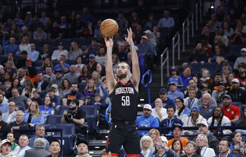 Mar 3, 2025; Oklahoma City, Oklahoma, USA; Houston Rockets guard Jack McVeigh (58) shoots a three point basket against the Oklahoma City Thunder during the second half at Paycom Center. Mandatory Credit: Alonzo Adams-Imagn Images