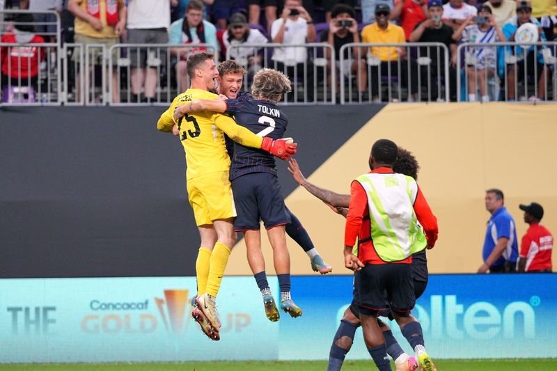 Jun 29, 2025; Minneapolis, Minnesota, USA; United States of America goalkeeper Matthew Freese (25) and midfielder Jack Mcglynn (6) and defender John Tolkin (2) celebrate after defeating Costa Rica in a quarterfinal match of the 2025 Gold Cup at U.S. Bank Stadium.