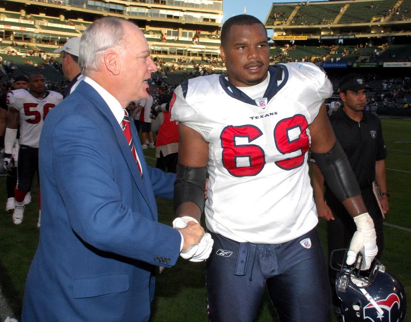 Nov 4, 2007; Oakland, CA, USA; Houston Texans owner Robert McNair aka Bob McNair shakes hands with Chester Pitts (69) after 24-17 victory over Oakland Raiders at McAfee Coliseum. Mandatory Credit: Kirby Lee/Image of Sport-USA TODAY Sports