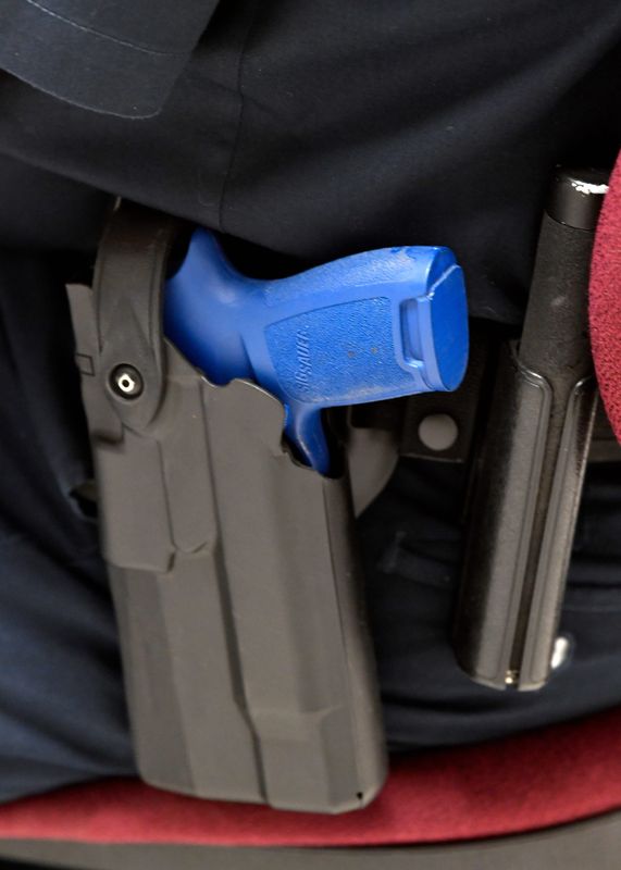 A blue polyurethane “gun” is holstered on a cadet’s belt during class at the San Angelo Police Academy June 18, 2025.