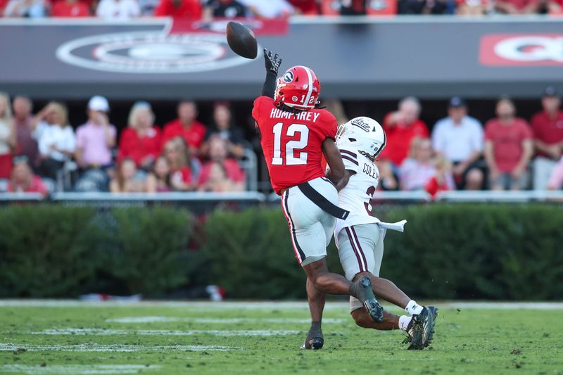 Oct 12, 2024; Athens, Georgia, USA; Georgia Bulldogs defensive back Julian Humphrey (12) defends a pass intended for Mississippi State Bulldogs wide receiver Kevin Coleman Jr. (3) in the second quarter at Sanford Stadium. Mandatory Credit: Brett Davis-Imagn Images