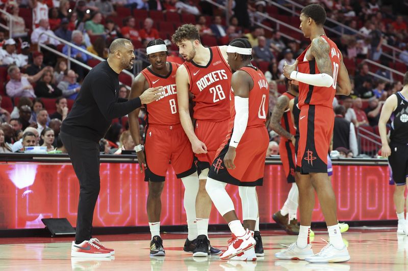 Apr 2, 2025; Houston, Texas, USA; Houston Rockets head coach Ime Udoka talks with players during the fourth quarter against the Utah Jazz at Toyota Center. Mandatory Credit: Troy Taormina-Imagn Images
