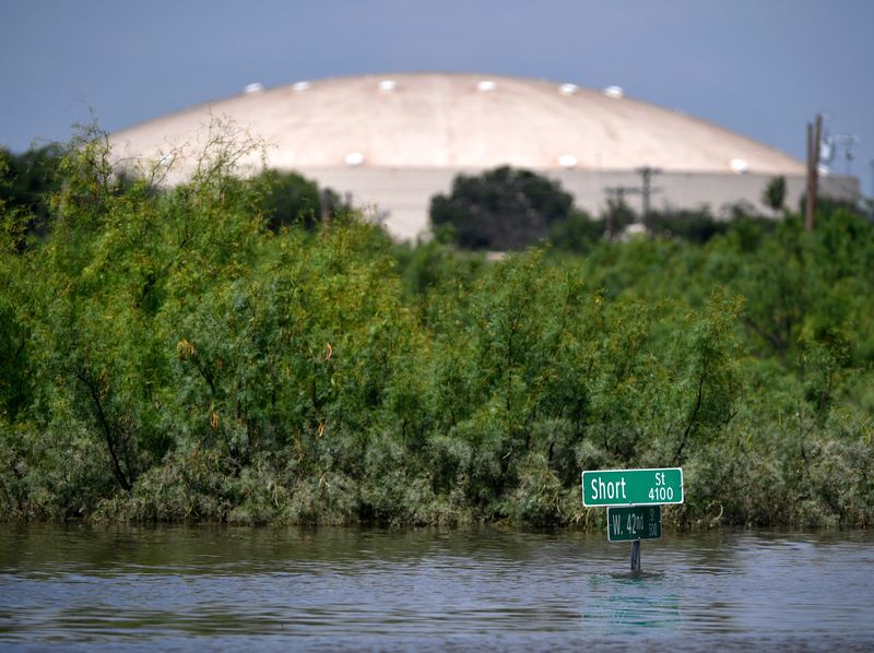 CRC Roofers Coliseum rises above the floodwaters at Short and W.42nd streets in San Angelo Saturday July 5, 2025.
